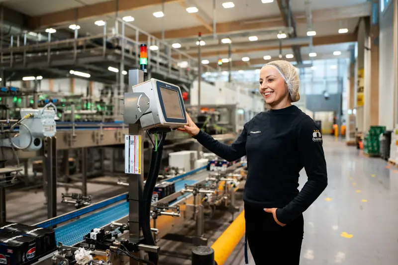 An Ölgerðin employee at a bottling line
