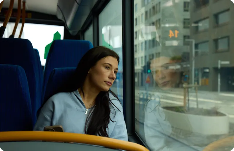 Someone looking out of a bus window